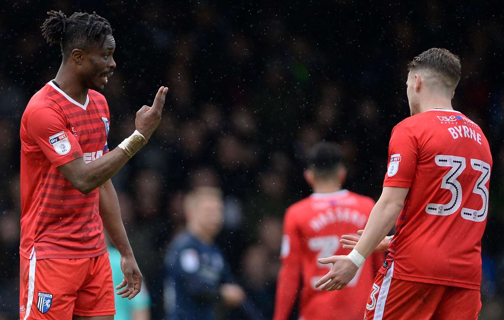 Gillingham's Gabriel Zakuani and Mark Byrne have an exchange of views against Southend. Picture: Ady Kerry