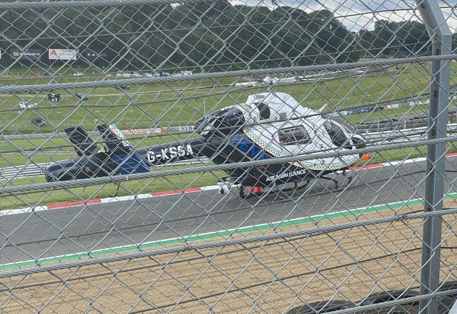 The air ambulance at the scene of the crash at Brands Hatch. Picture: @FlooringKimpton/Twitter