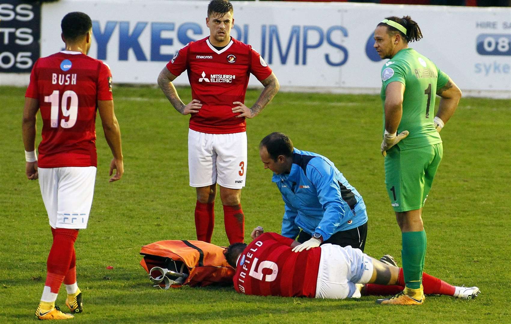 Dave Winfield is treated by Fleet physio Jamie Crosswell Picture: Sean Aidan