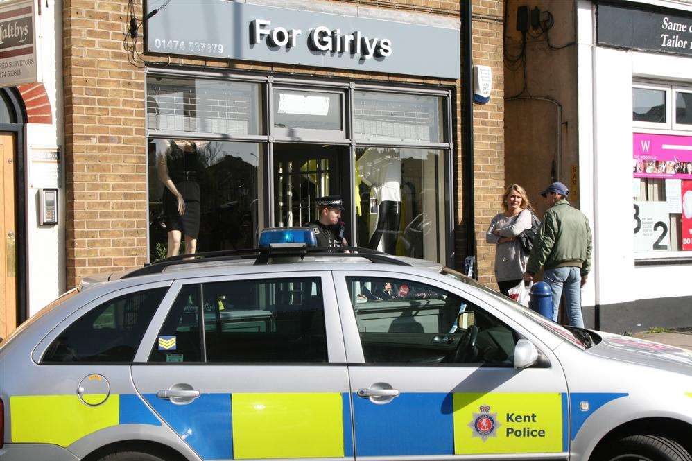 A police car outside the robbed store in Gravesend