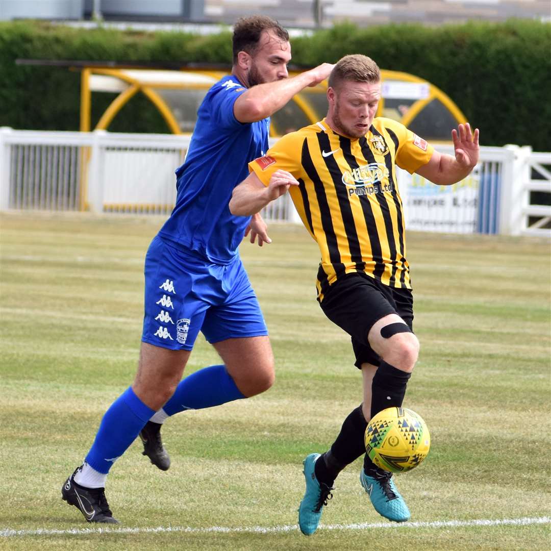 Action from Cheriton Road as Folkestone scorer Scott Heard takes the ball forward. Picture: Randolph File