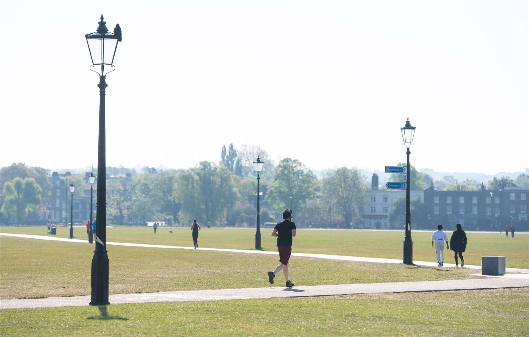 A runner on Blackheath, in south London, which is the start of the course for the London Marathon (Dominic Lipinski/PA)