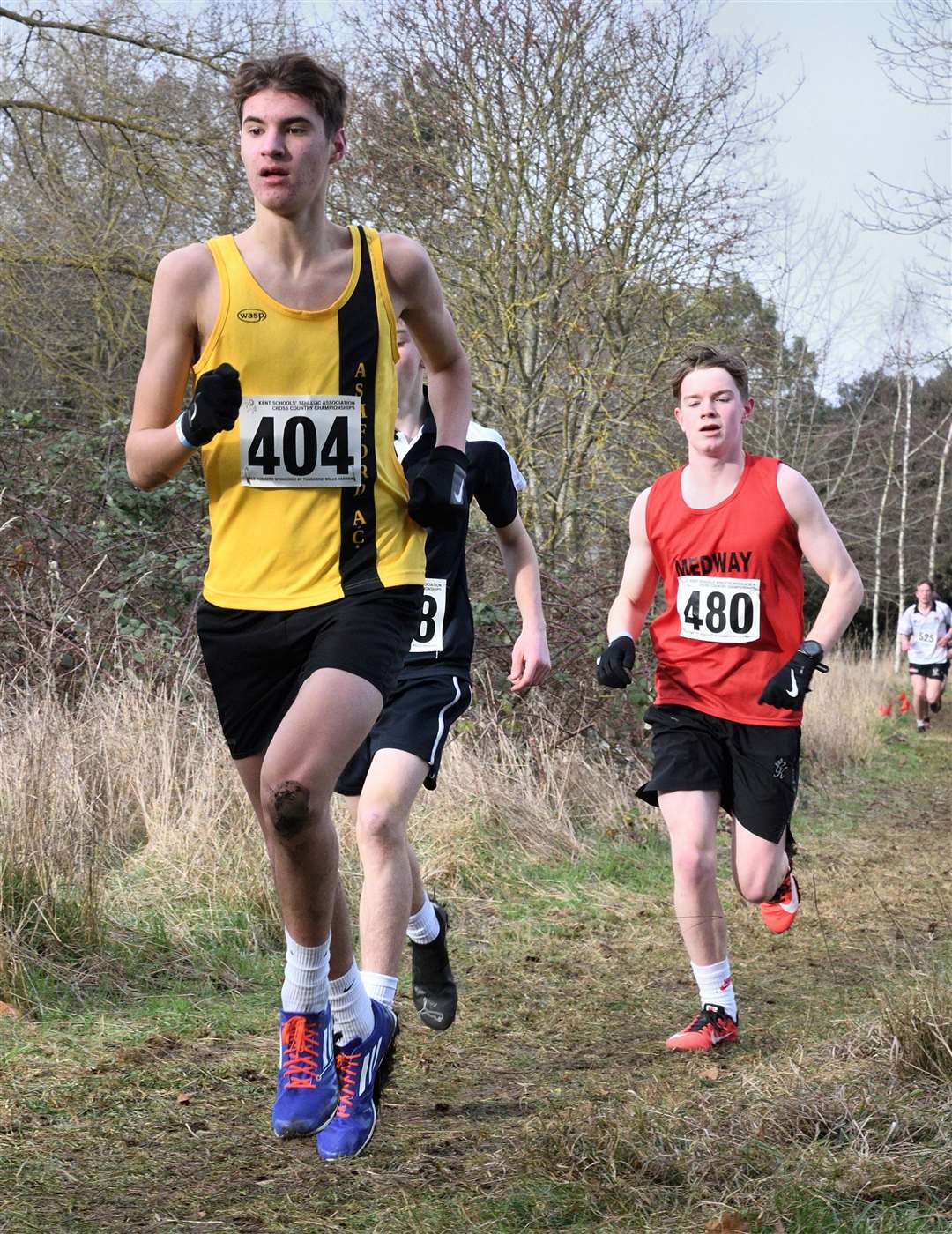 Ronnie Gawler (No.404) battles for Ashford & Weald in the intermediate boys’ class. Picture: Simon Hildrew