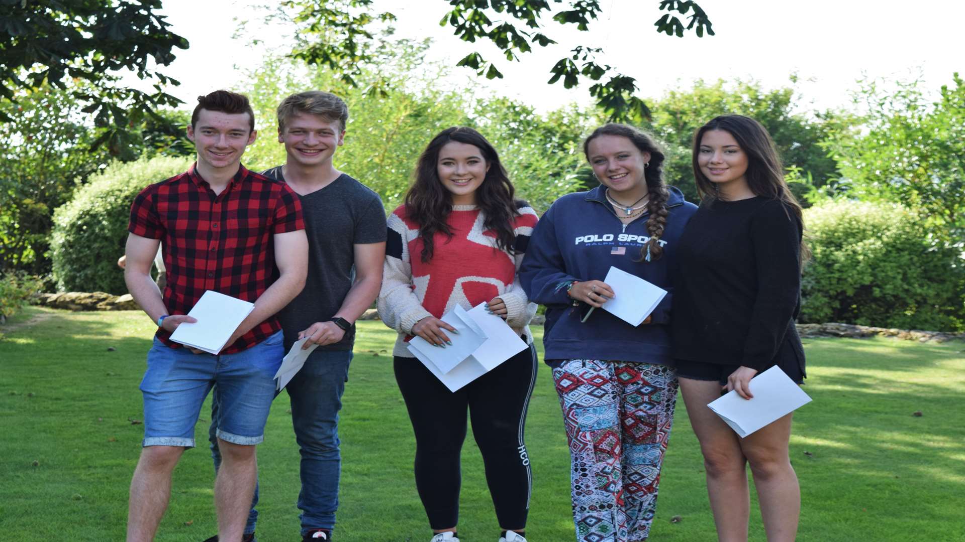 Students celebrate their results on Prefects’ Lawn at Sutton Valence School. Photo L-R: Tivey Nichols, Callum Traynor, Caitlin Allison, Eliza Lewis, Ellie Agu-Benson