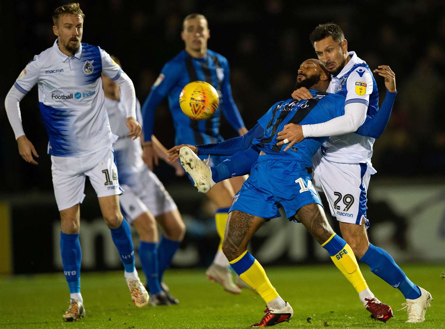 Josh Parker under pressure from former Gills defender Joe Martin