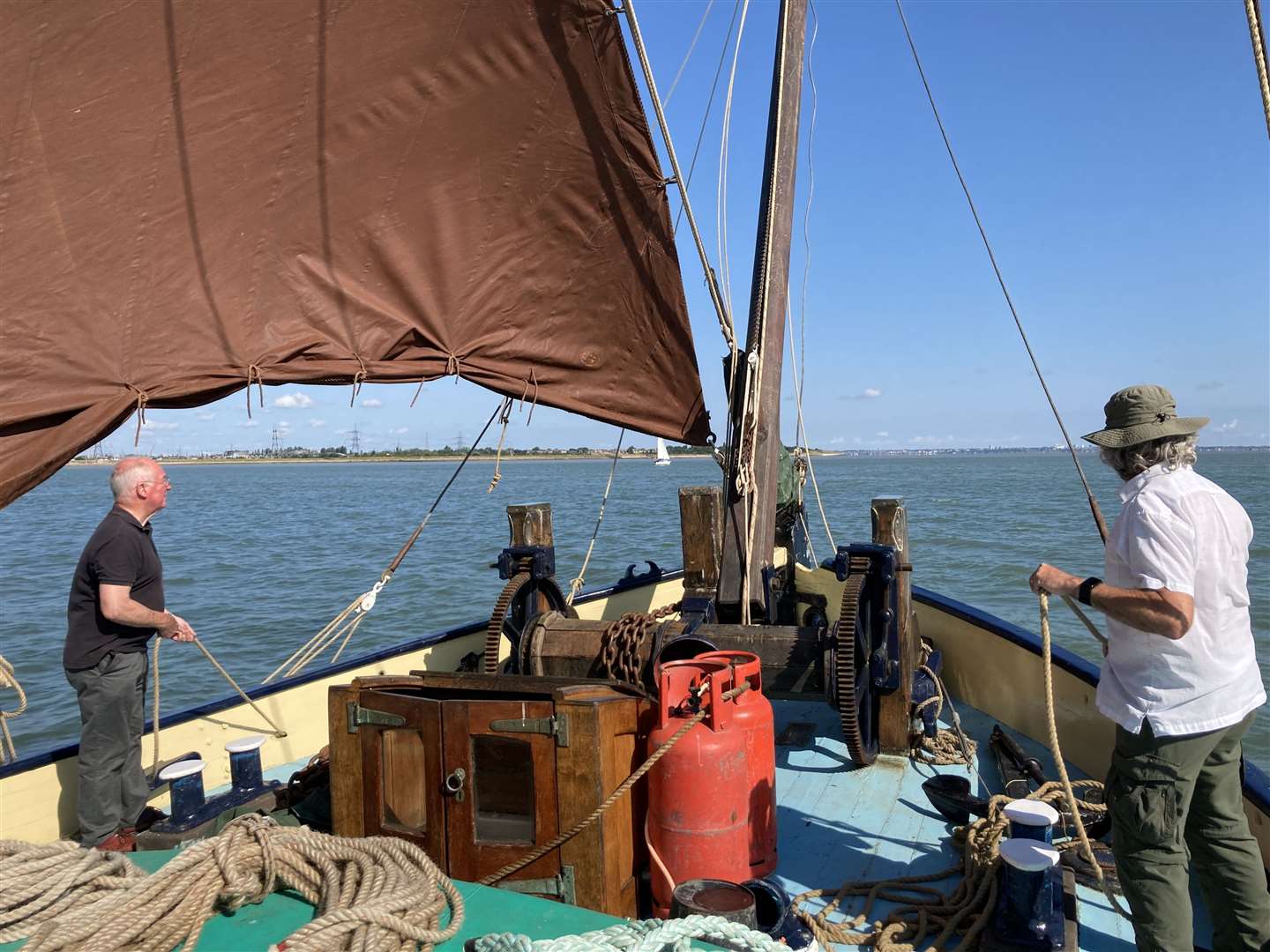 All hands on deck as Richard Murr and Bob Morris muck in aboard the Edith May