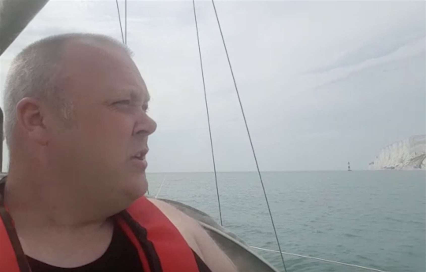 Britain First skipper Samuel Cochrane aboard the 'HMS Alfred the Great' in the English Channel looking for migrants. Picture: Britain First