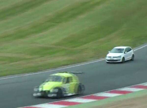 The white VW Polo gate-crashed the race at Brands Hatch