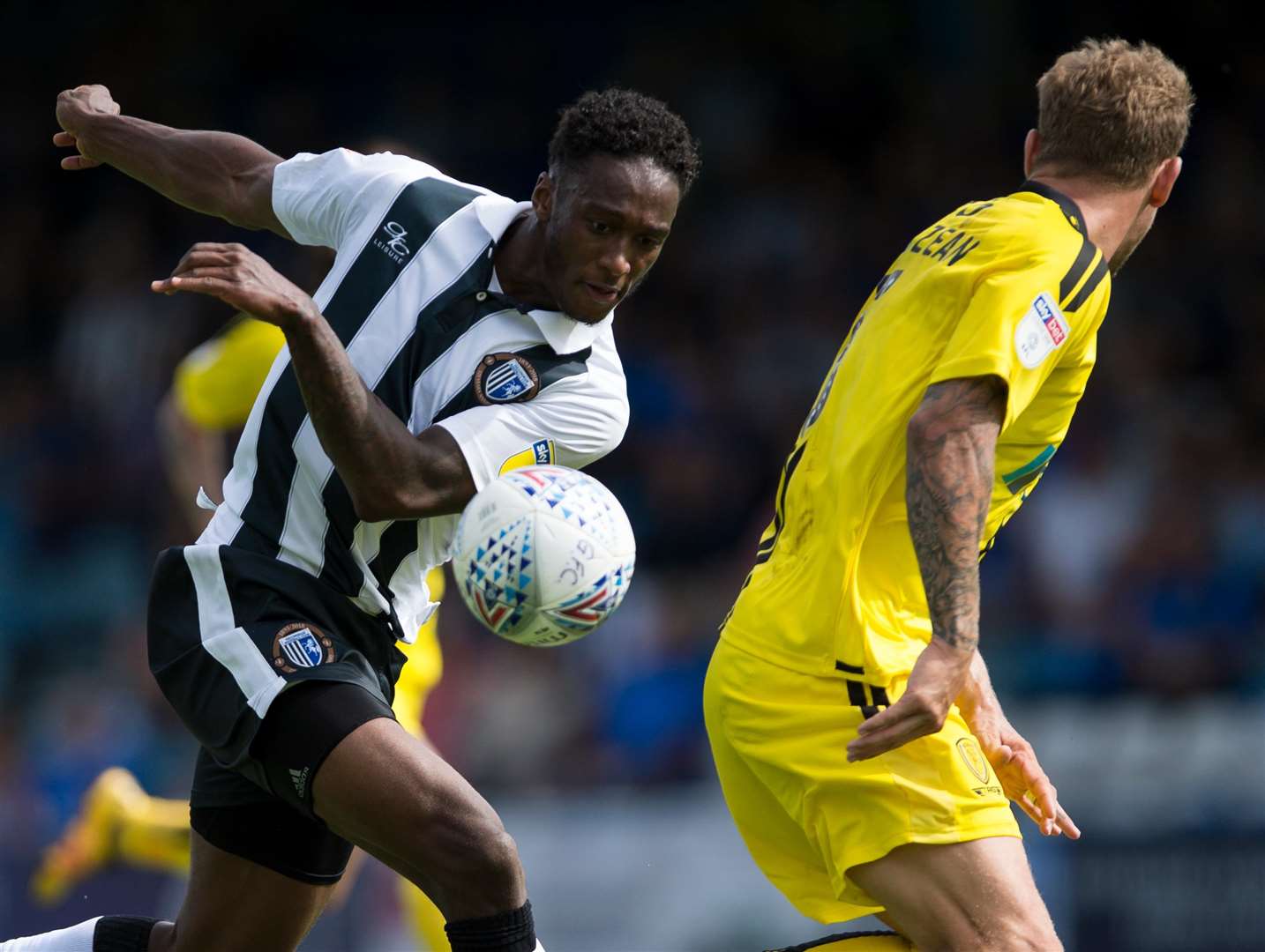 Brandon Hanlan does battle with Burton's Kyle McFadzean Picture: Ady Kerry