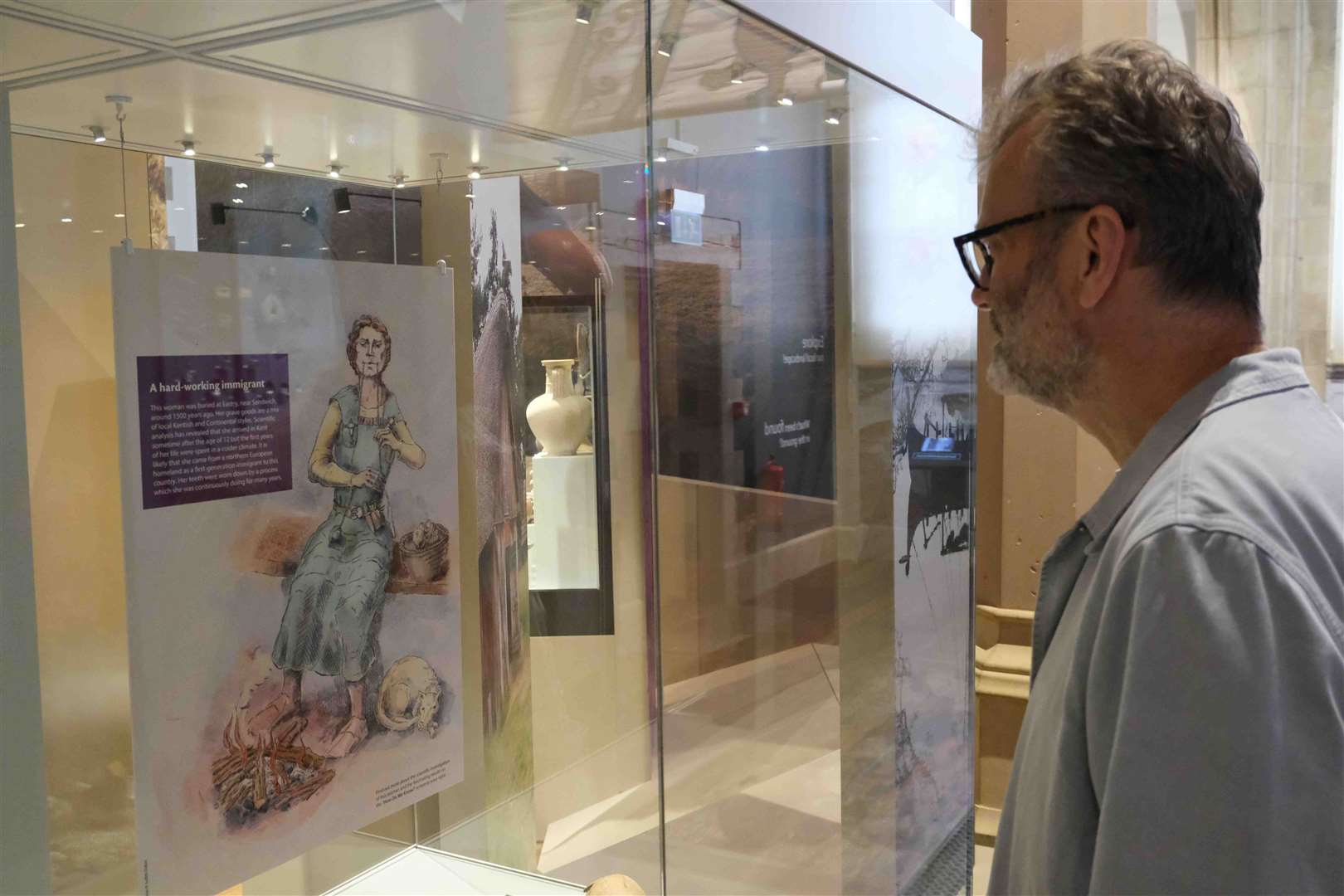 Hugh Dennis learning about the Eastry lady in the new Lives In our Landscape Gallery at Maidstone Museum