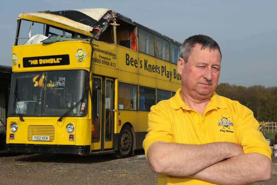 Norman Laverock with his play bus that has been written off by a tree in Detling