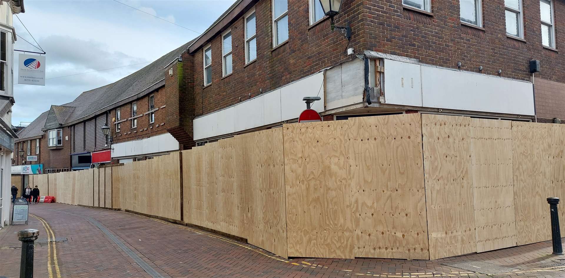 Hoardings went up around the site in February