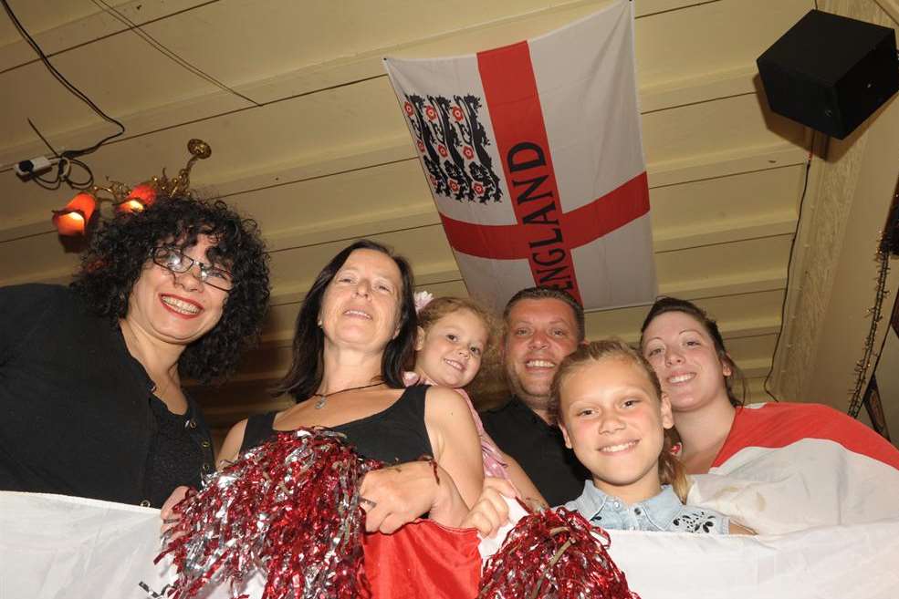 The Cricketers in Gillingham. L-R: barmaids Nina D'Souza, Sally Scutts, landlord Stephen McNoughton with daughters, Ellie (5) and Libby (11) and barmaid Gemma Thompson