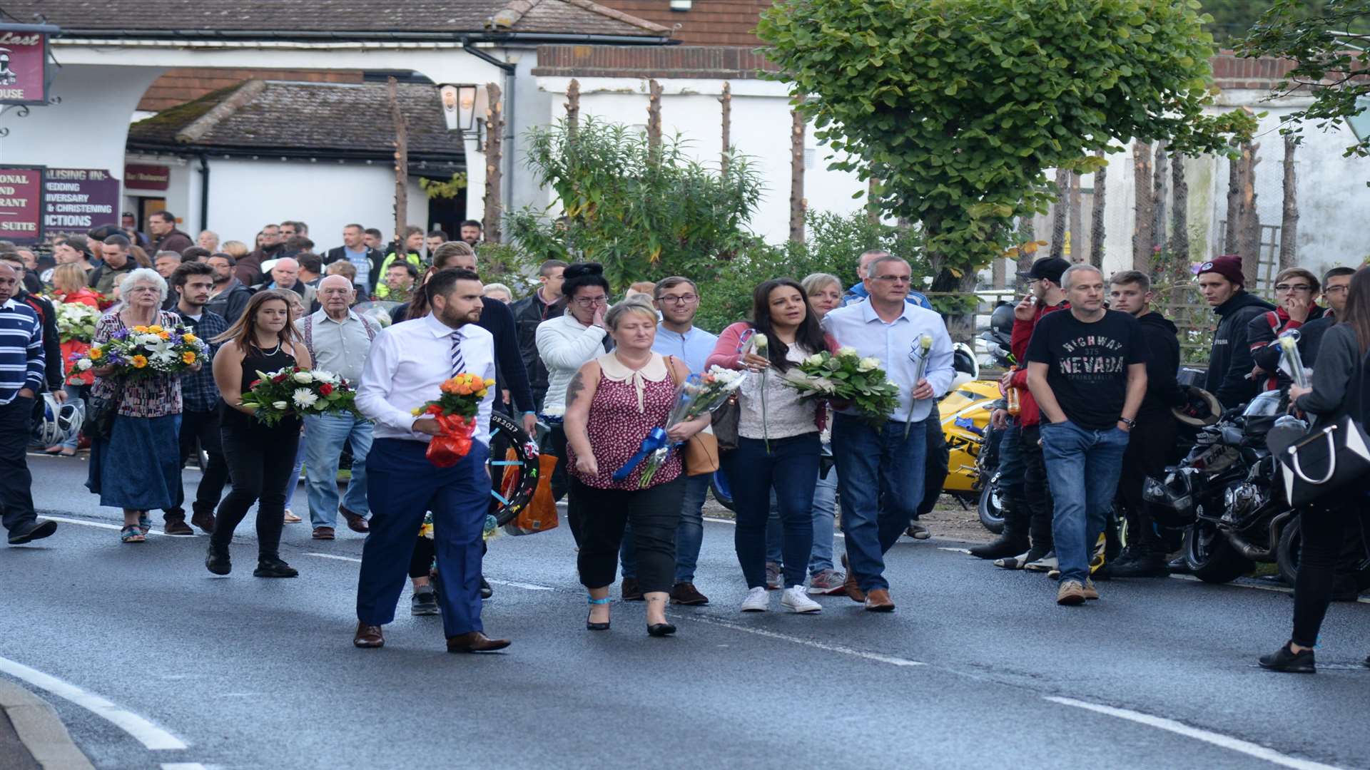 Family and friends of Jack Whichello on the Canterbury Road, Herne for the laying of floral tributes this evening