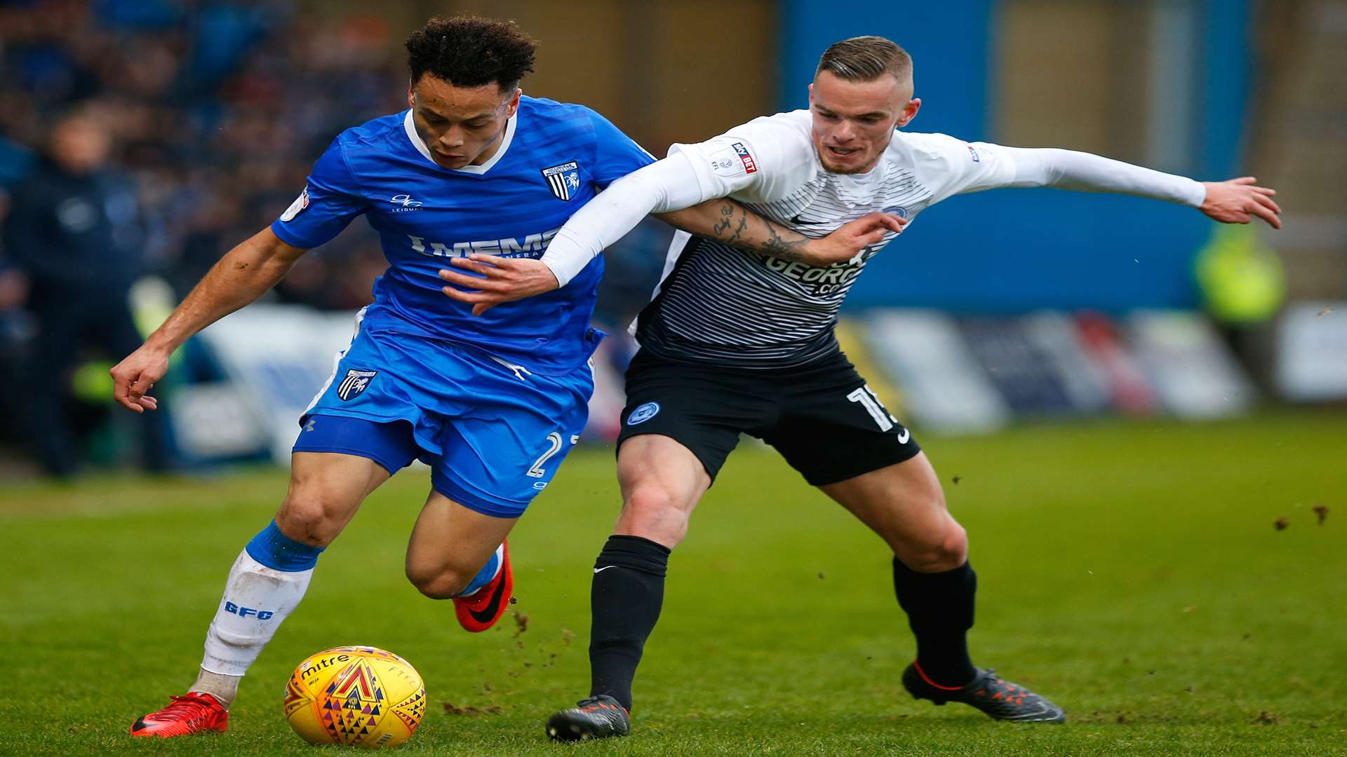 Gillingham forward Elliott List tries to get beyond Joe Ward. Picture: Andy Jones