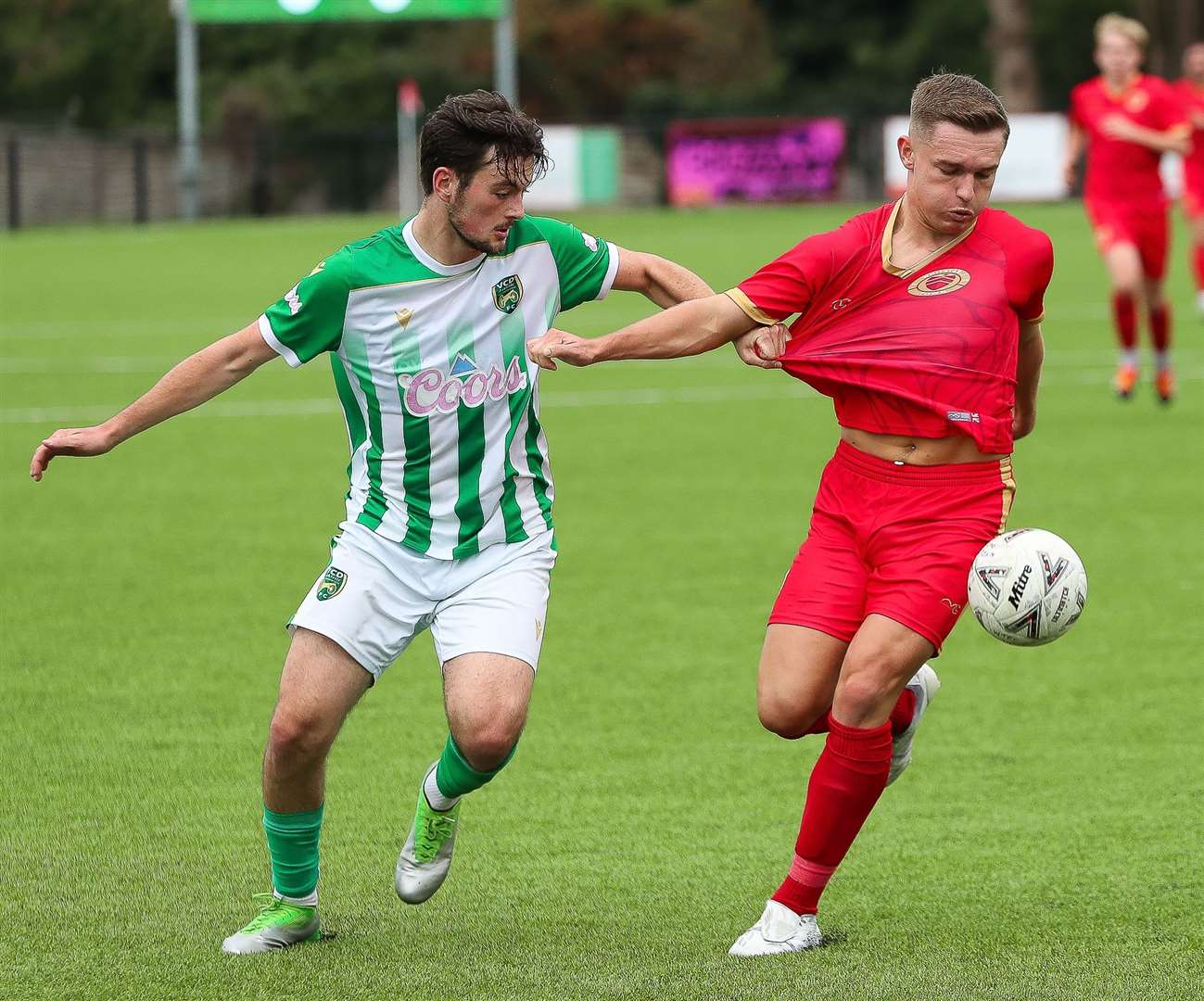 Whitstable’s Josh Oliver gets his shirt tugged during last weekend’s defeat at home to leaders VCD Picture: Les Biggs