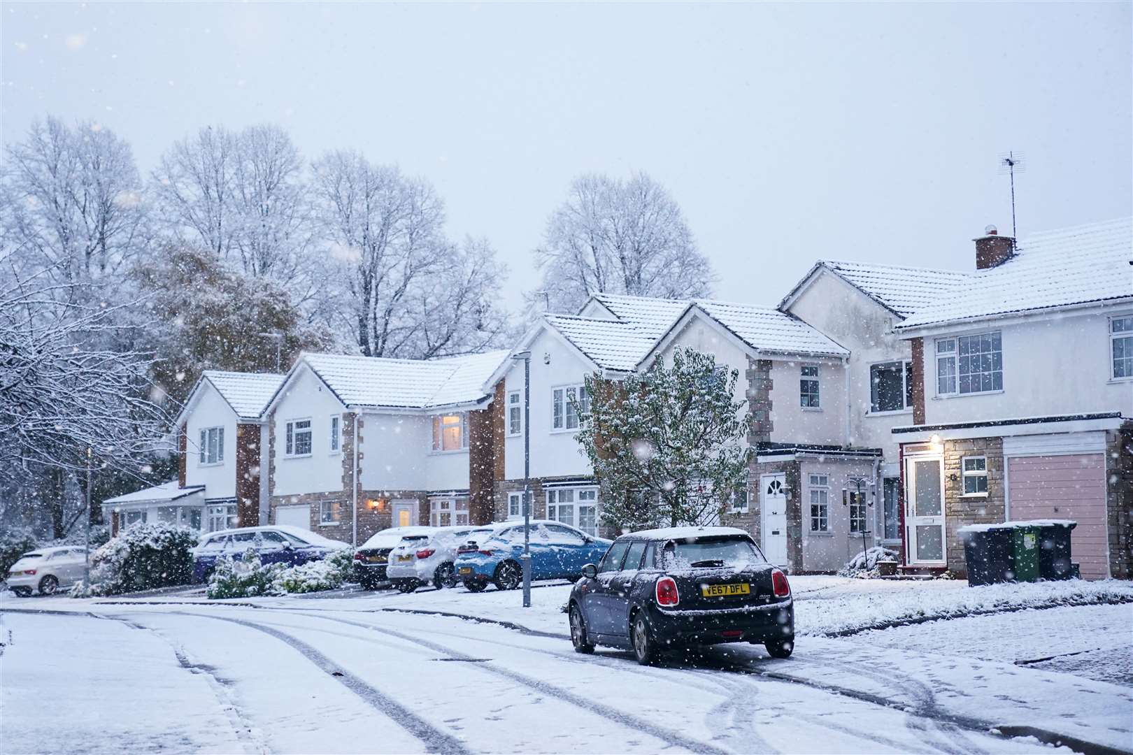 Snow-covered homes after overnight snowfall in Warwick (Jacob King/PA)