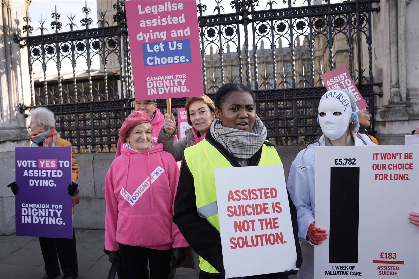 People in support of and opposing the Terminally Ill Adults (End of Life) Bill (Stefan Rousseau/PA)