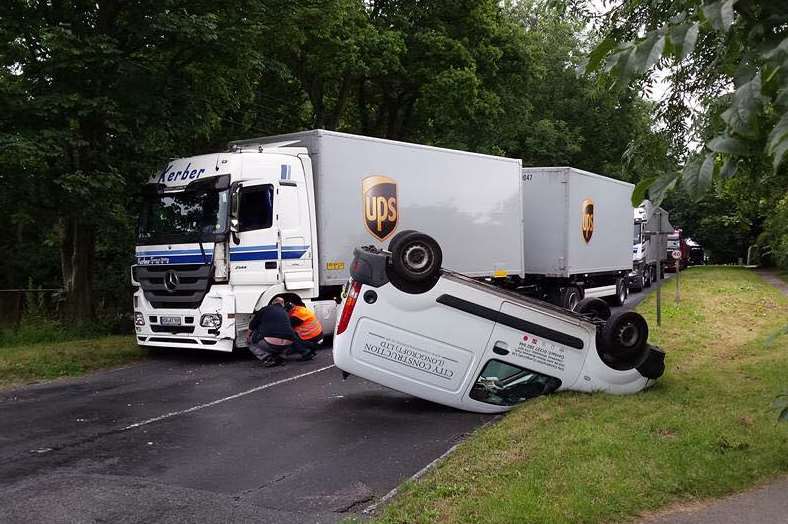 A van flipped onto its roof after the smash