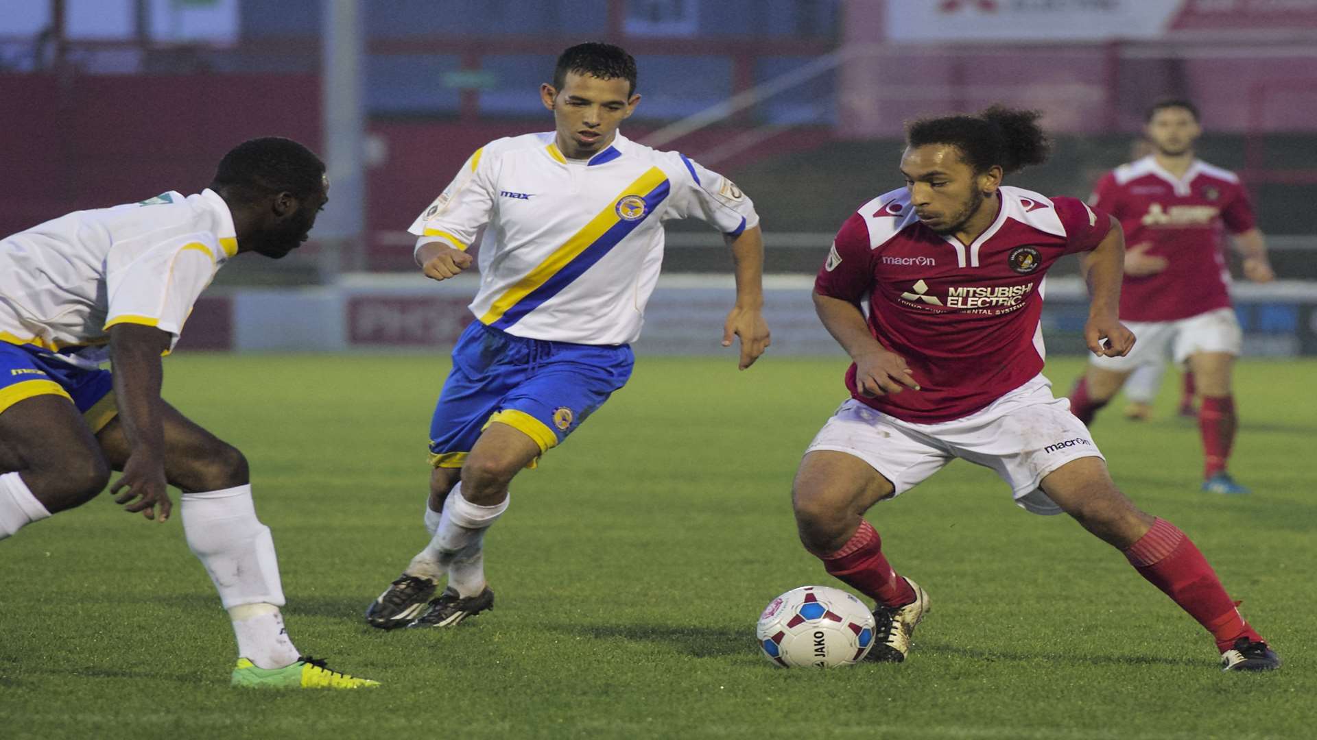 Brendan Kiernan takes on two players on his full Ebbsfleet debut Picture: Andy Payton