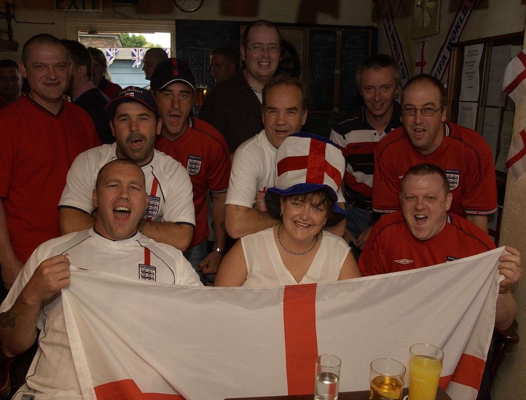 Fans watch England take on Brazil at The Six Bells in Gravesend during the 2002 World Cup