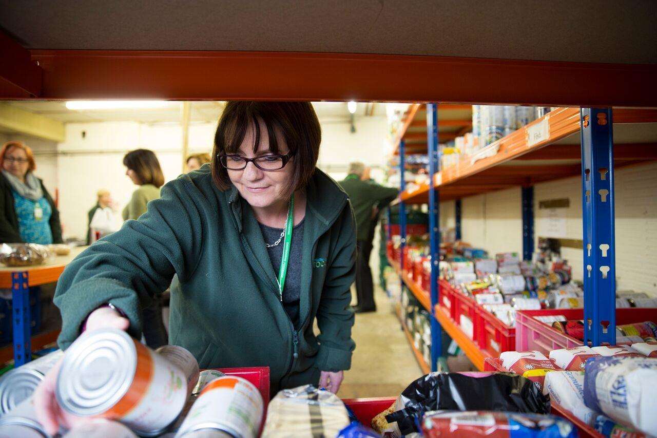 A volunteer checks supplies at a Trussell Trust foodbank storage unit (5237603)