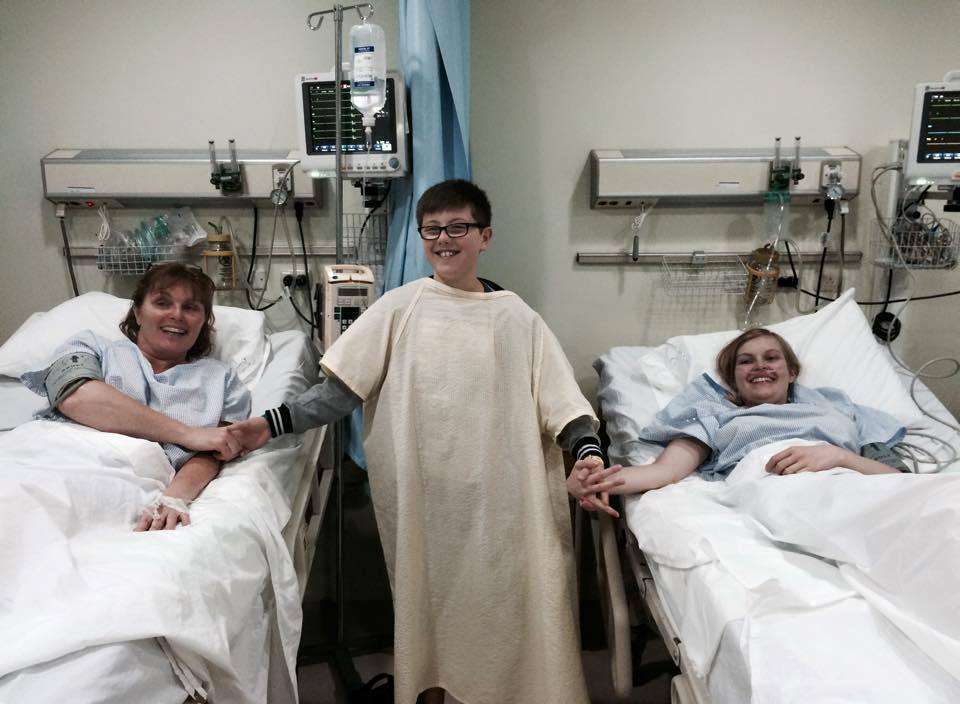 Roisin and her mum Anntoinette lying in bed, with brother Cian