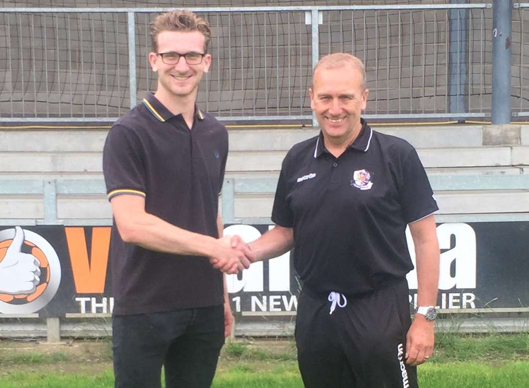 New signing Keaton Wood shakes hands with Dartford manager Tony Burman