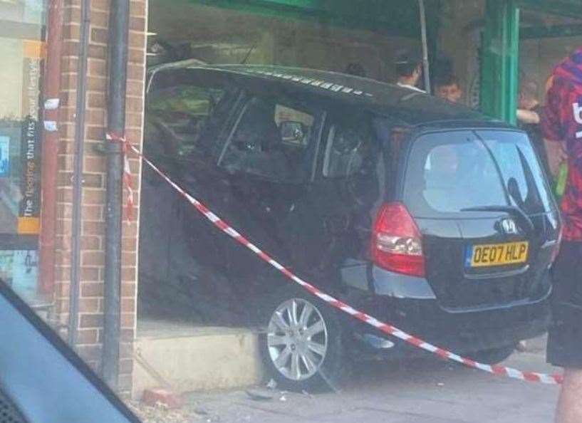 A car smashed into the front window of Papa John's in Twydall earlier this week