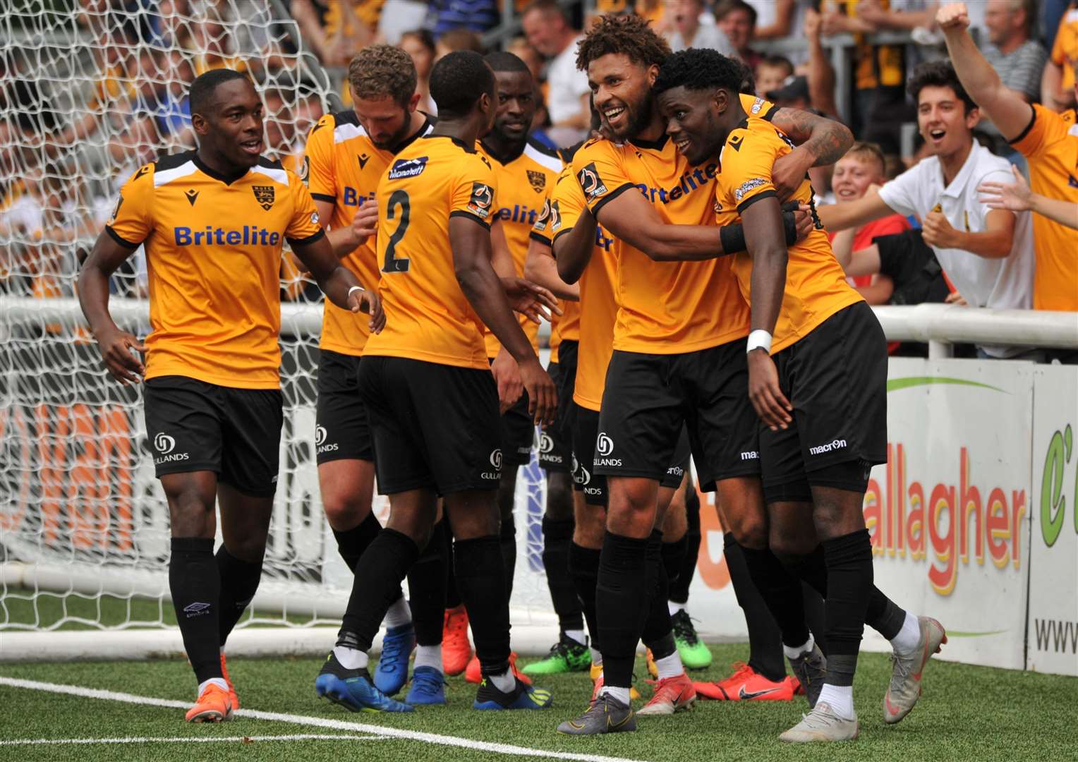 Jonny Edwards, second right, congratulates Justin Amaluzor on his goal against Weymouth Picture: Steve Terrell