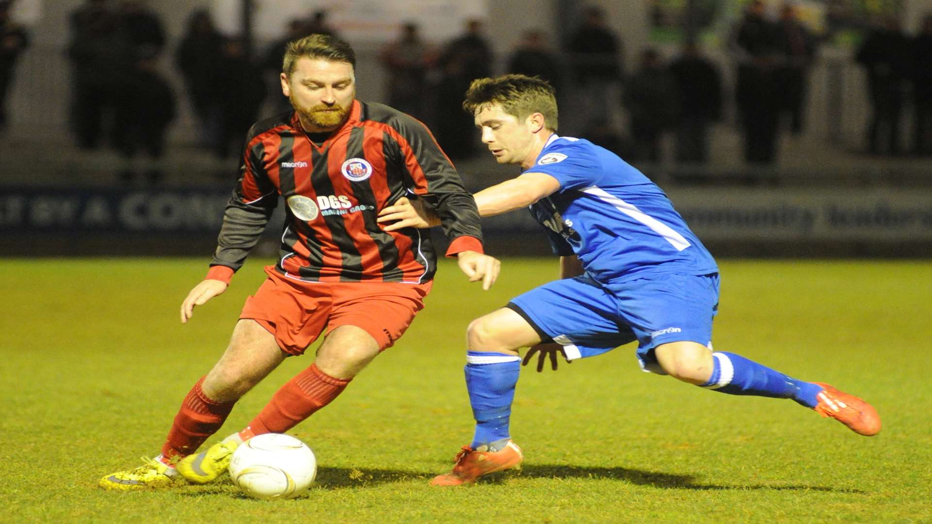 Peter Sweeney takes on his former team-mate Lee Noble Picture: Steve Crispe