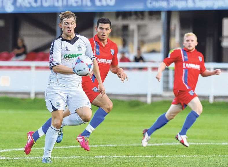 Liam Marrs keeps watch as John Egan challenges Dover's Tom Murphy Picture: Tony Flashman