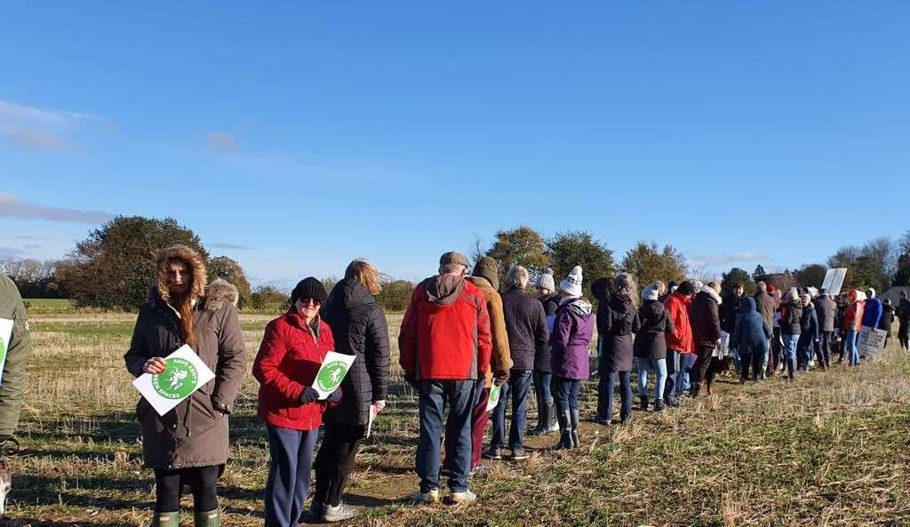 Protestors walk a field which goes from Tradescant Drive to Green Lane which they fear could be lost to housing. Picture: David Lee