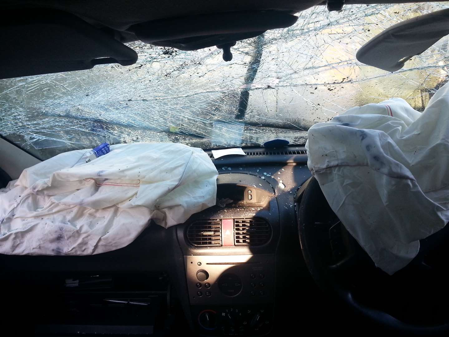 The windscreen of the blue Vauxhall Corsa was shattered