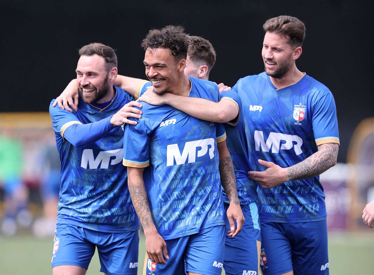 Troy Howard, centre, celebrates after restoring Market Hotel’s lead early in the second half. Picture: PSP Images