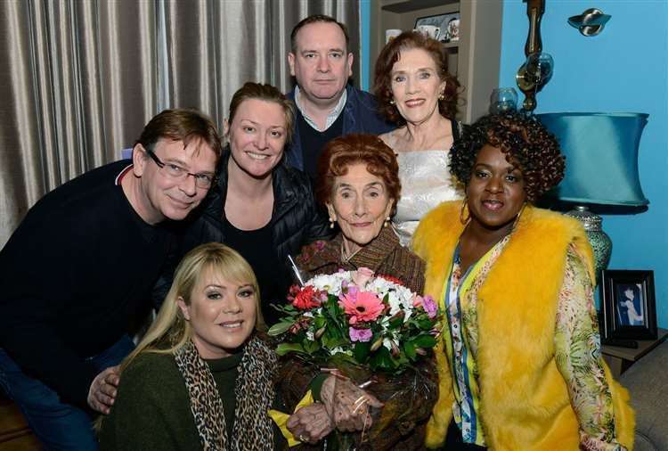 EastEnders stars Adam Woodyatt, Letitia Dean, Laurie Brett, Sean O’Connor, Linda Marlowe and Tameka Empson surprise June Brown to help her celebrate her 90th birthday on the set. Picture: Kieron McCarron/BBC/PA