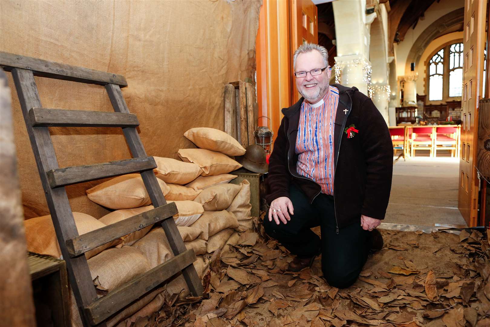 Vicar Chris Key in the trench scene built inside St Luke's Church