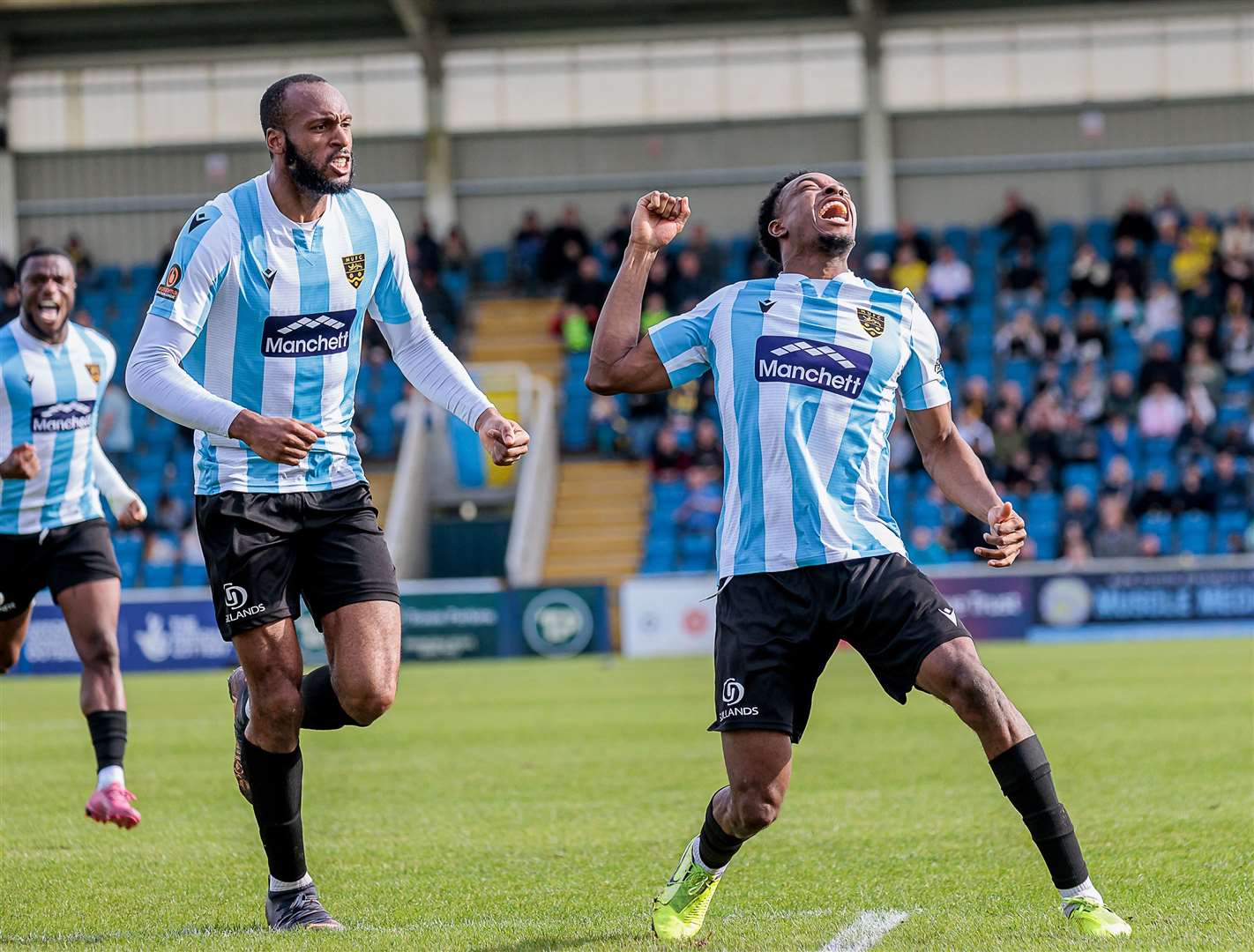 A special moment for Raphe Brown after scoring Maidstone's winner at Farnborough, while Reiss Greenidge joins the celebrations. Picture: Helen Cooper