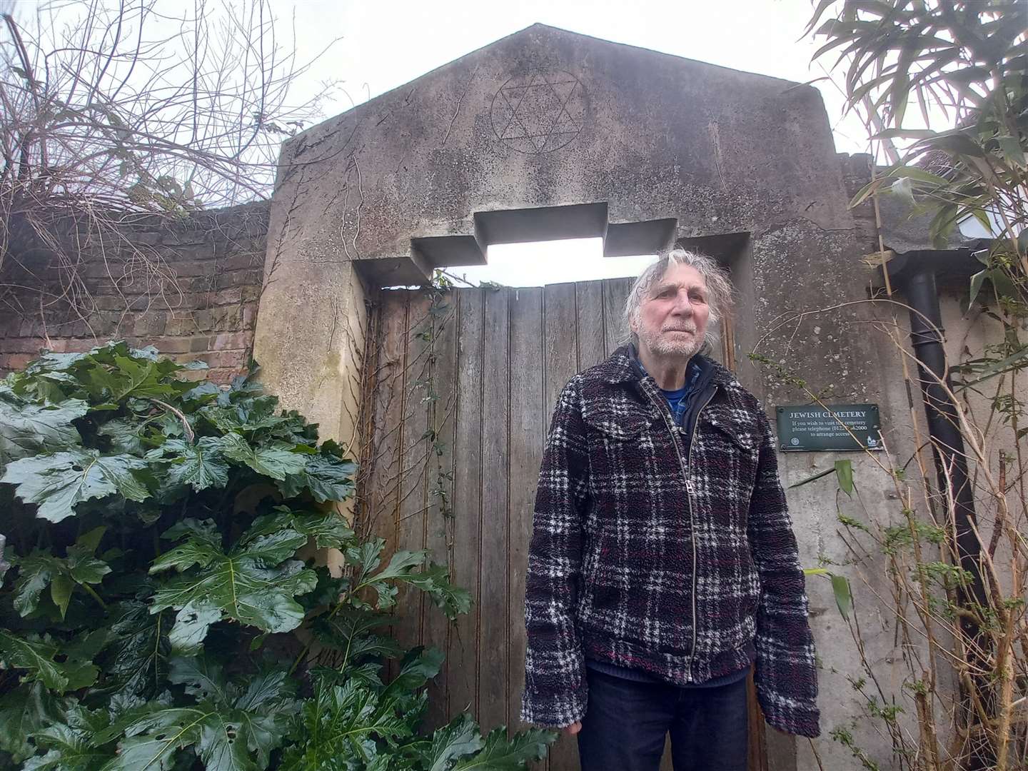 Jim Hampshire is the key keeper of the cemetery