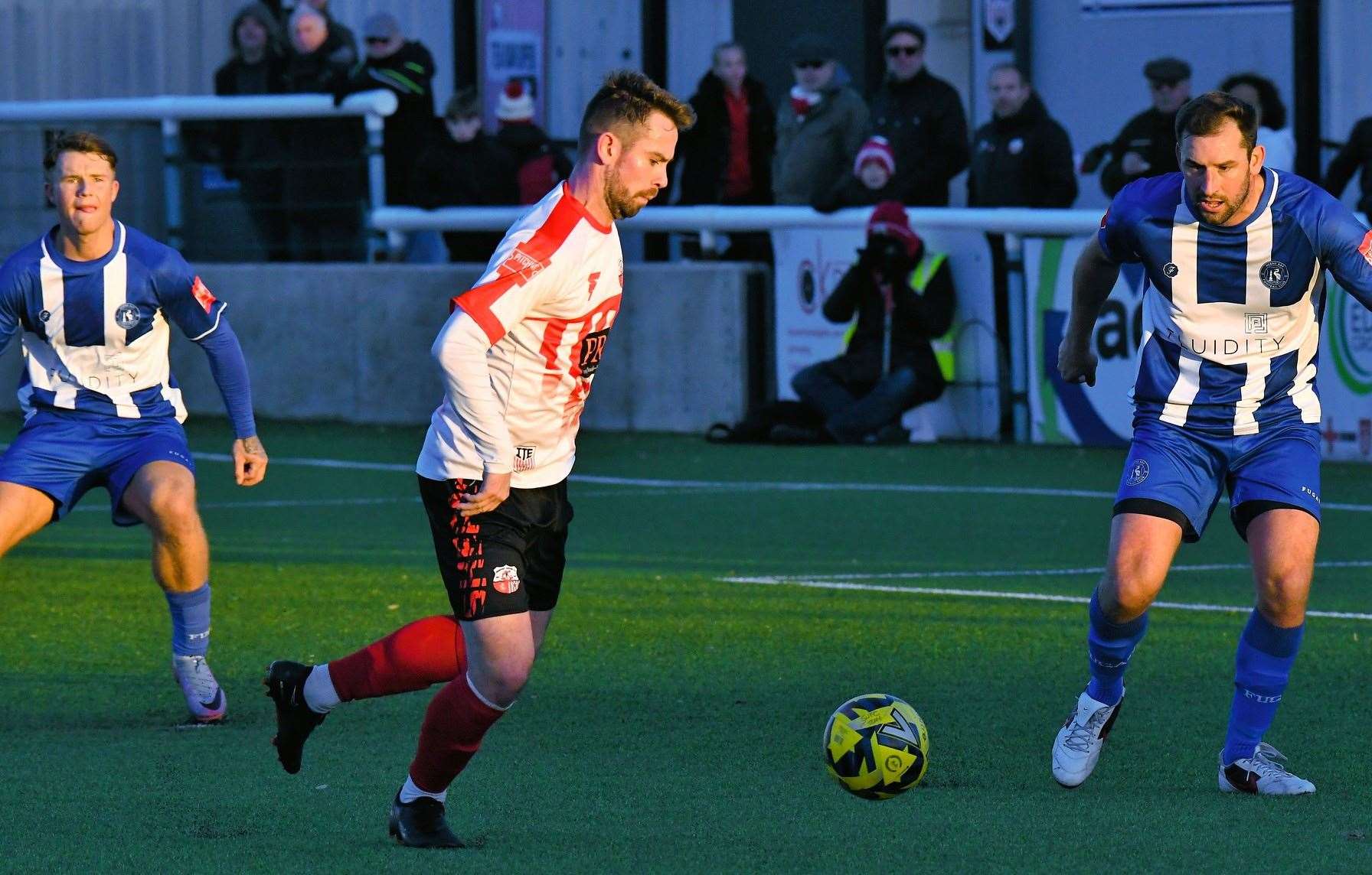 Sheppey United striker Alex Willis up against Herne Bay player-coach Liam Friend. Picture: Marc Richards