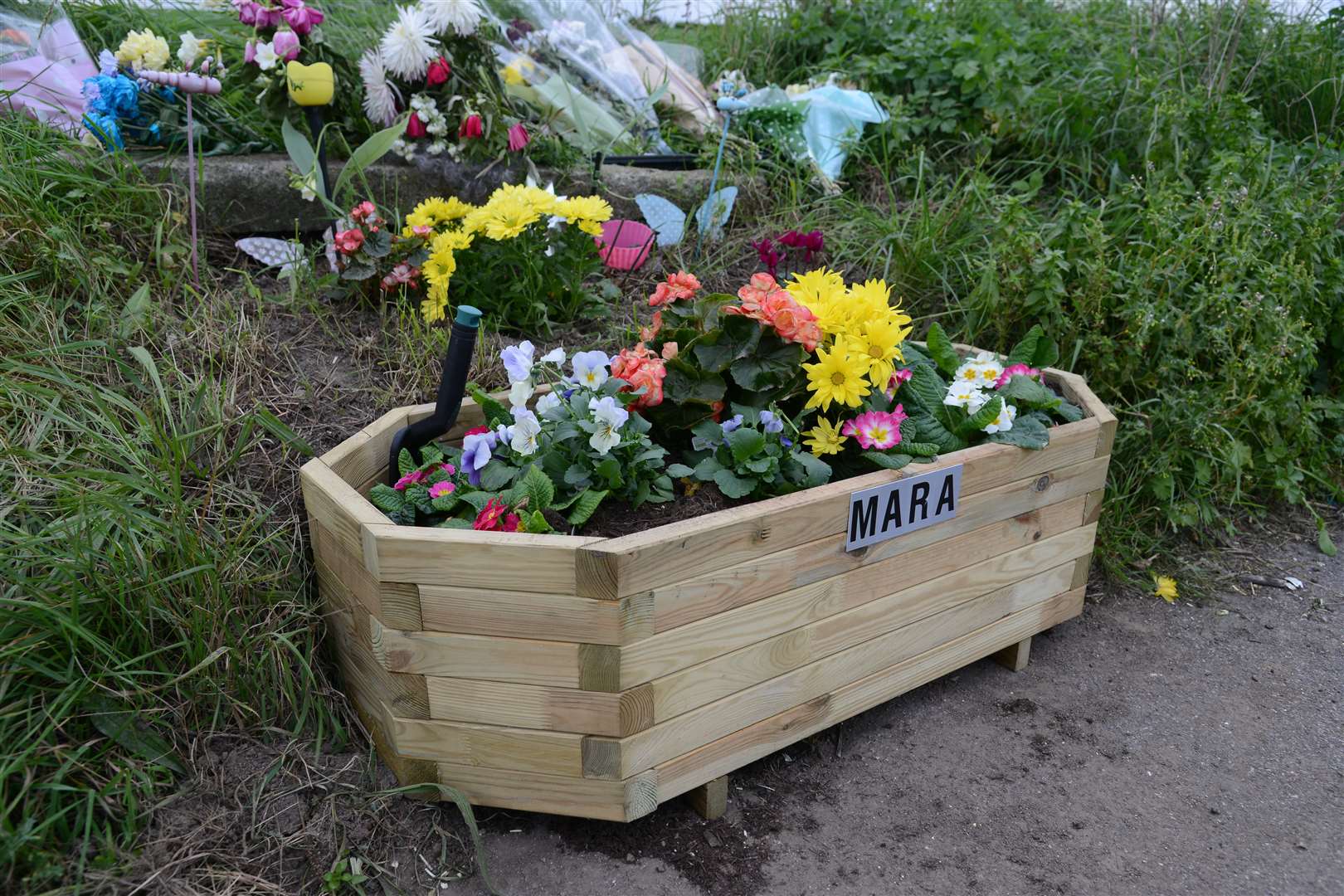 Floral tributes at the scene of the accident on the A258