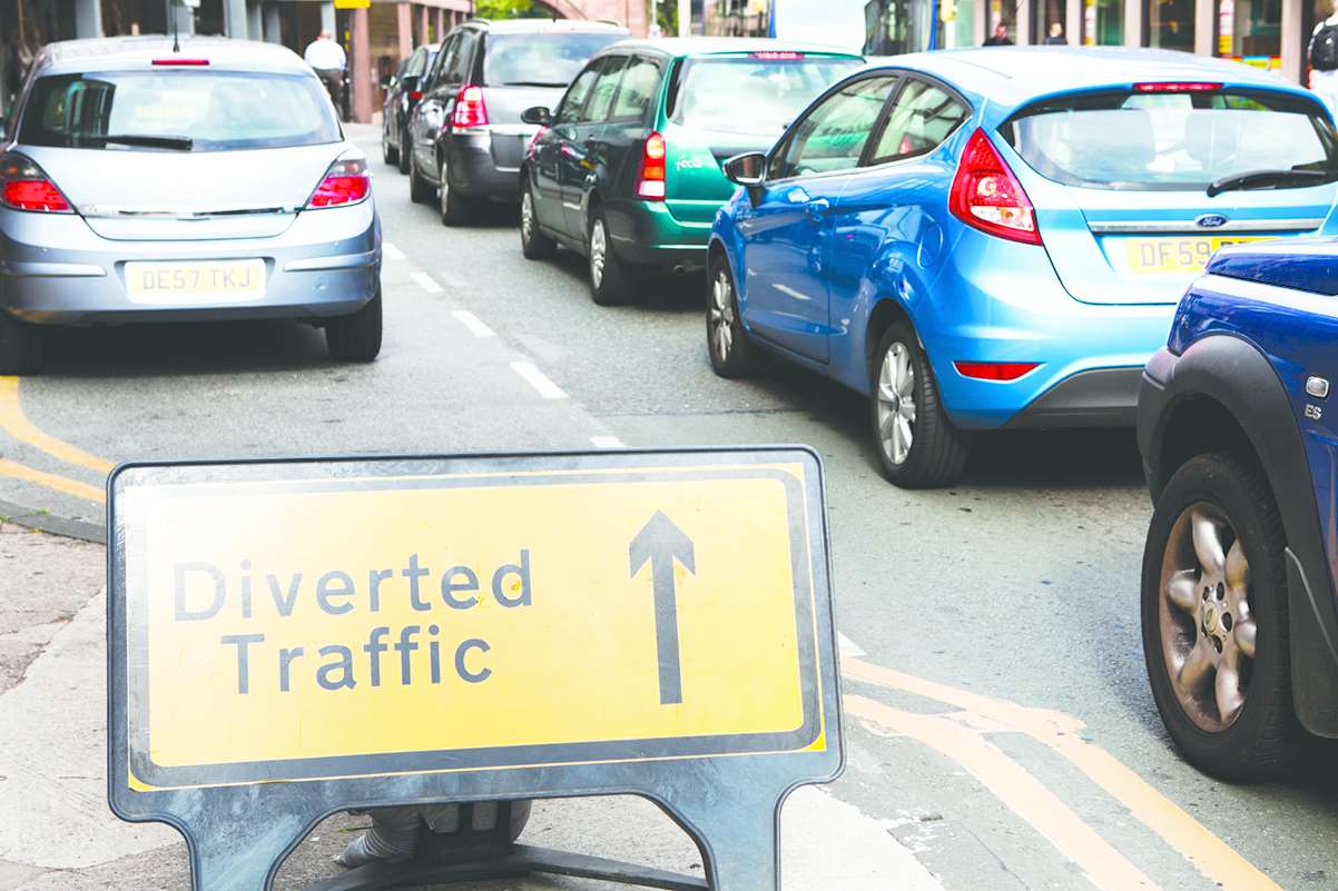 The vehicle fire is causing traffic delays. Stock image