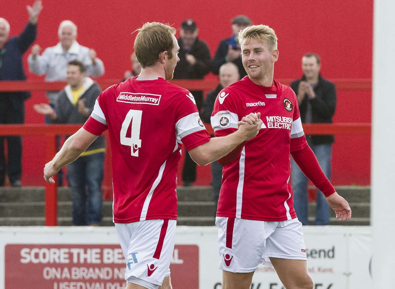 Stuart Lewis congratulates Jordan Parkes as Ebbsfleet go 2-0 up Picture: Andy Payton