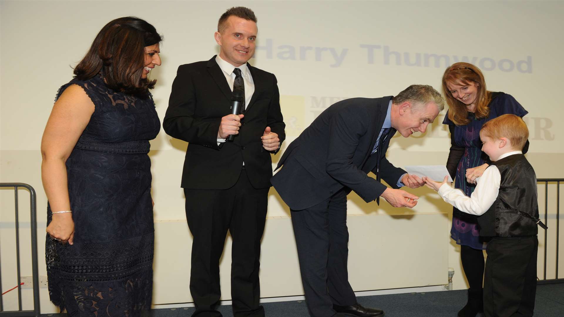 Medway Messenger editor Bob Bounds and Phil Gallagher present Harry Thumwood with his sponsor award