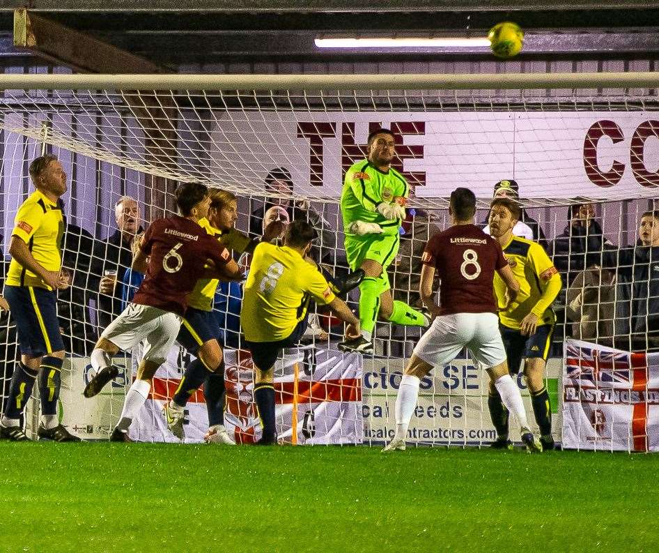 Dan Eason punches clear at the Pilot Field. Picture: Les Biggs