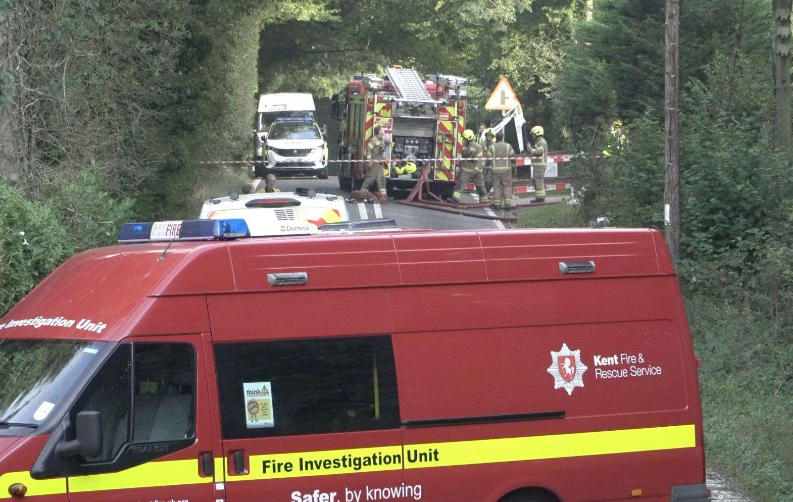 Firefighters at the scene damping down hotspots after an explosion destroyed a house in Charing