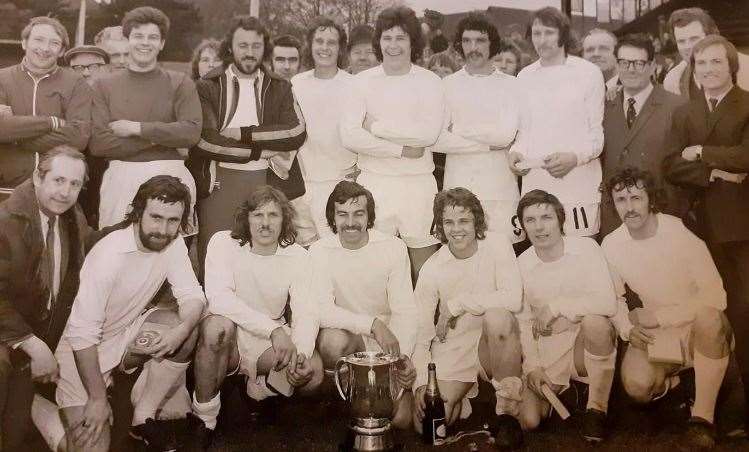 Dave Bright (kneeling behind the trophy) with his successful New Zealand club at Manurewa