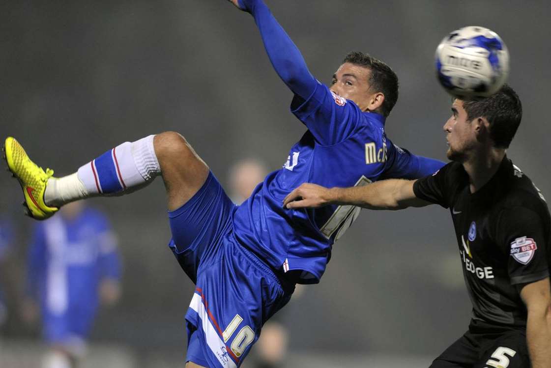 Matchwinner Cody McDonald tries the spectacular in Gillingham's 2-1 win over Peterborough Picture: Barry Goodwin