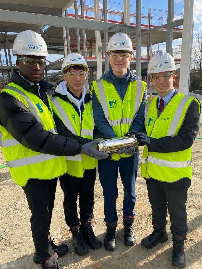 Pupils Telvin Owusu, Owen Li, Tadeusz Wisniewki and Ventsi Lyubomirov with time capsule