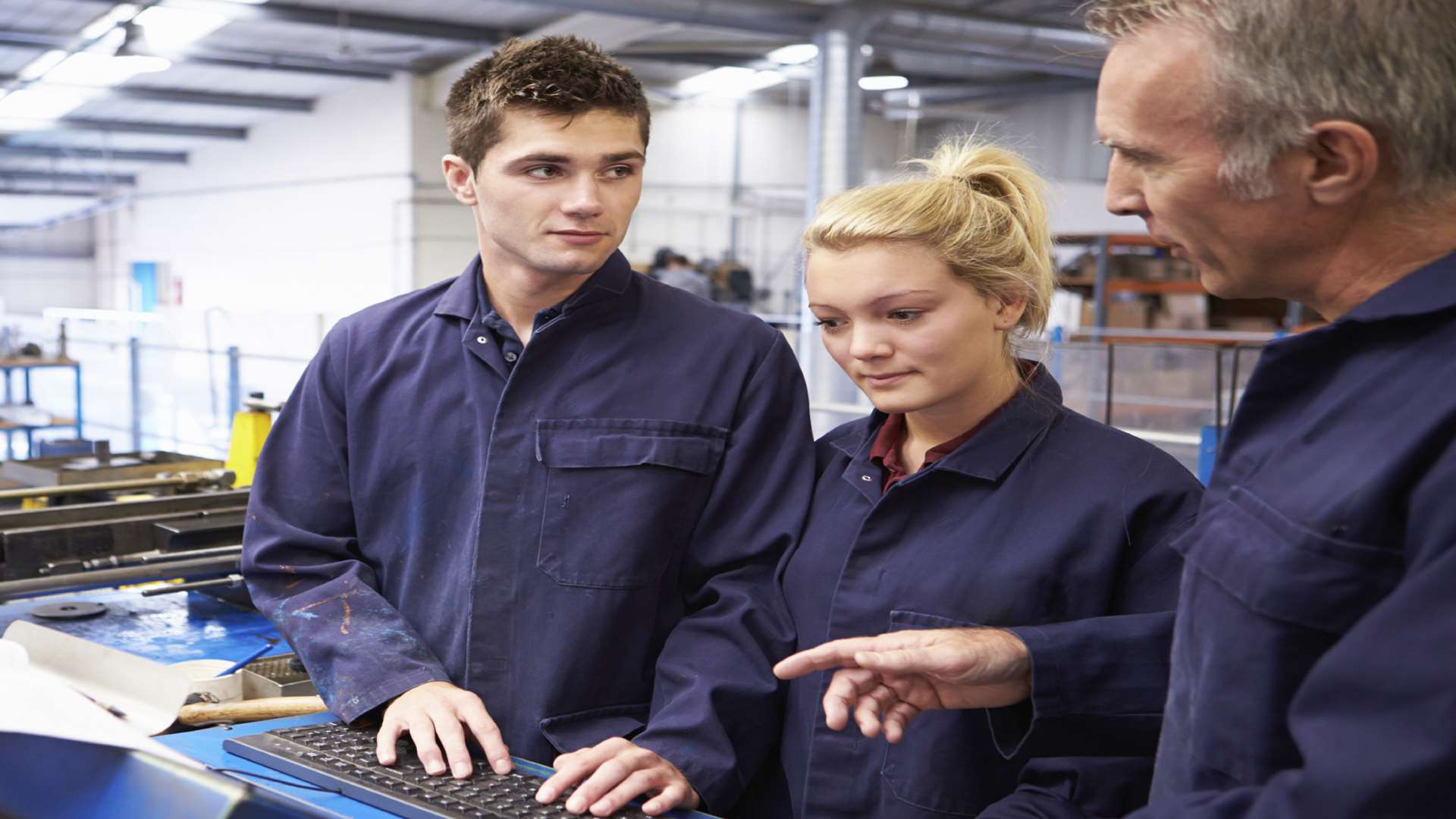 Engineer teaches apprentices